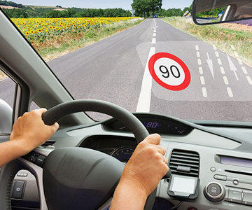 Driving car metion 90 speed limit in windshield
