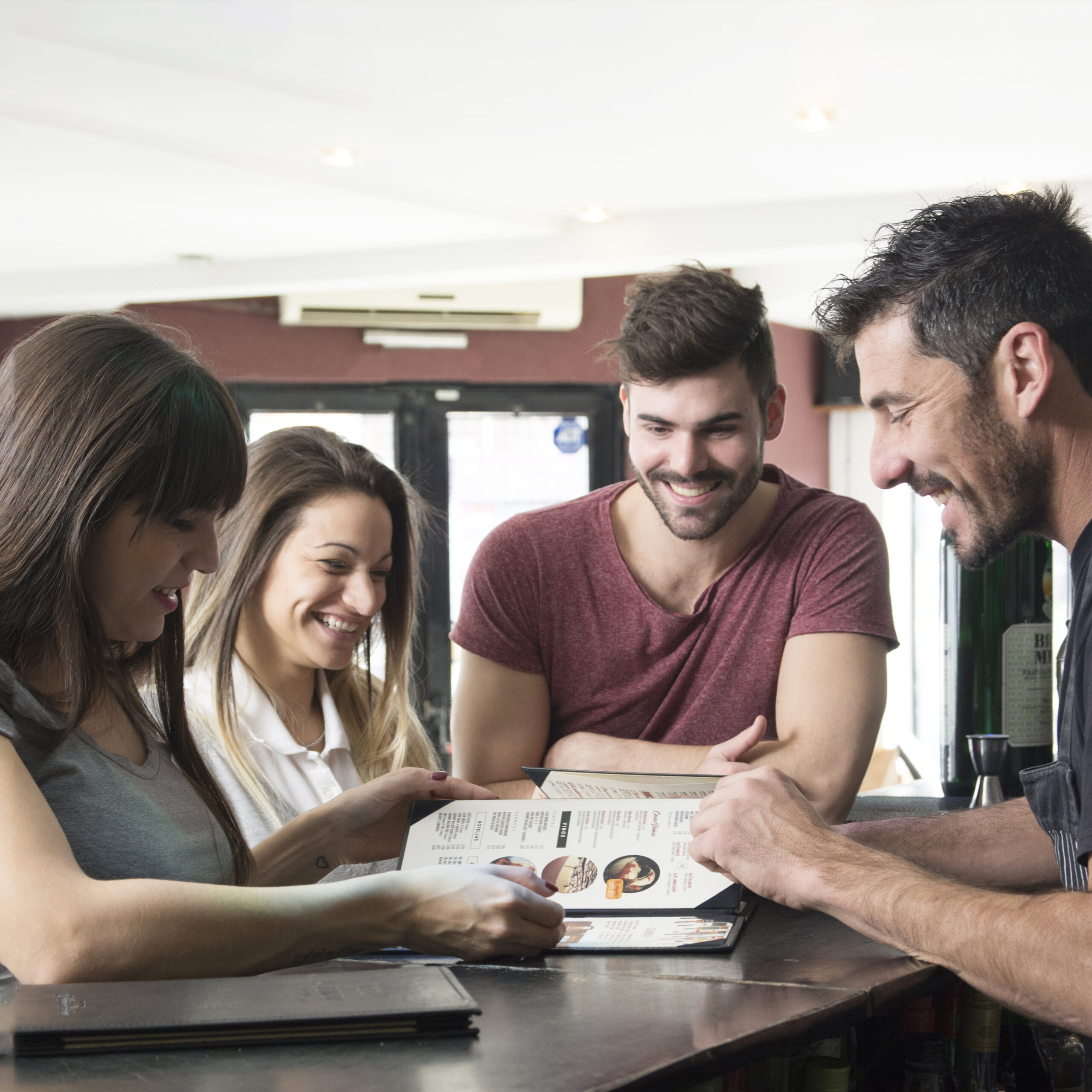 Satisfied driving school customers reviewing course options and pricing
